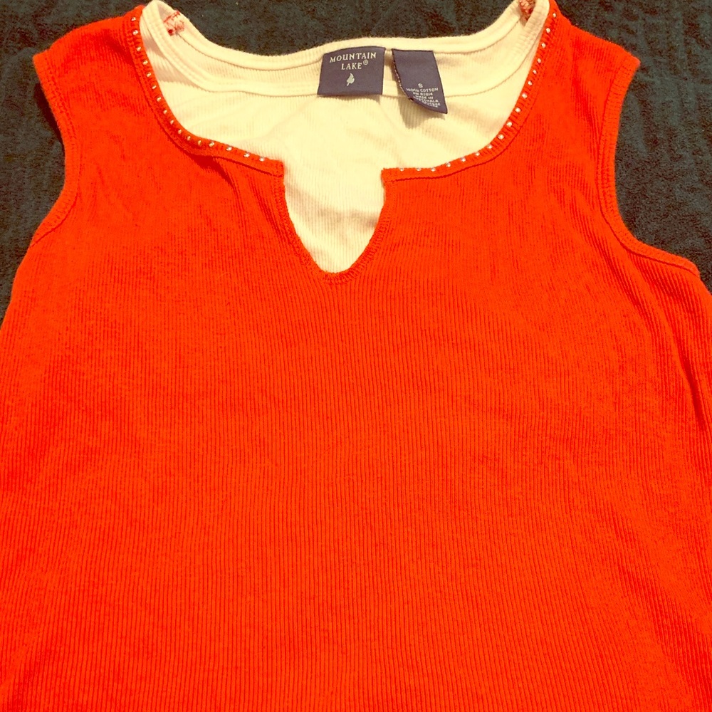 Red tank with white around collar